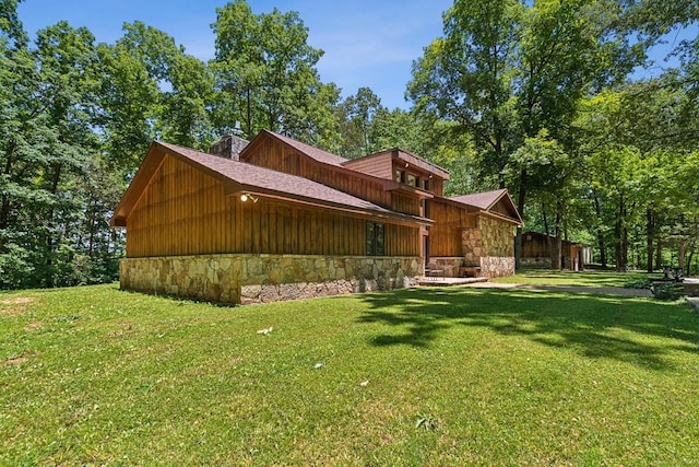 view of property exterior featuring a lawn