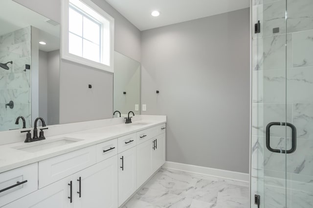 bathroom featuring vanity and a shower with shower door