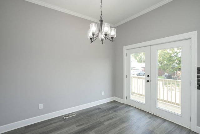 interior space with crown molding, dark hardwood / wood-style floors, an inviting chandelier, and french doors