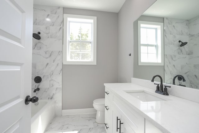 full bathroom with vanity, tiled shower / bath, a wealth of natural light, and toilet