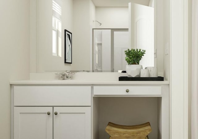 bathroom featuring vanity and a shower with shower door