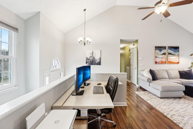 office featuring dark wood-type flooring, ceiling fan with notable chandelier, and high vaulted ceiling