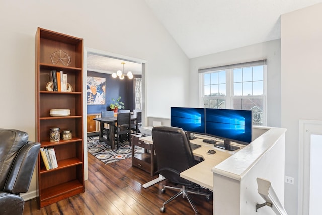 office space with lofted ceiling, dark wood-type flooring, and a notable chandelier