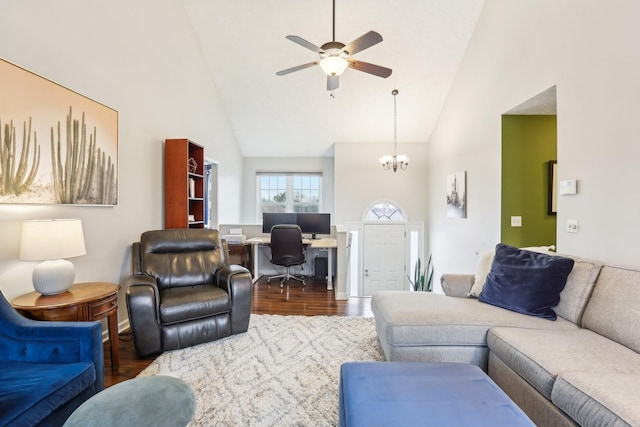 living room featuring ceiling fan with notable chandelier, wood-type flooring, and high vaulted ceiling