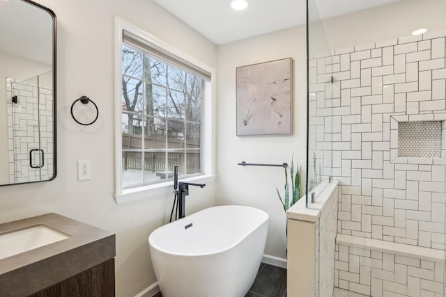 bathroom featuring independent shower and bath and vanity