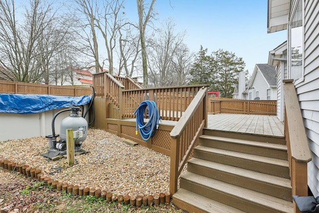 deck featuring a covered pool