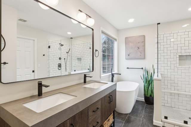 bathroom featuring vanity, tile patterned flooring, and separate shower and tub