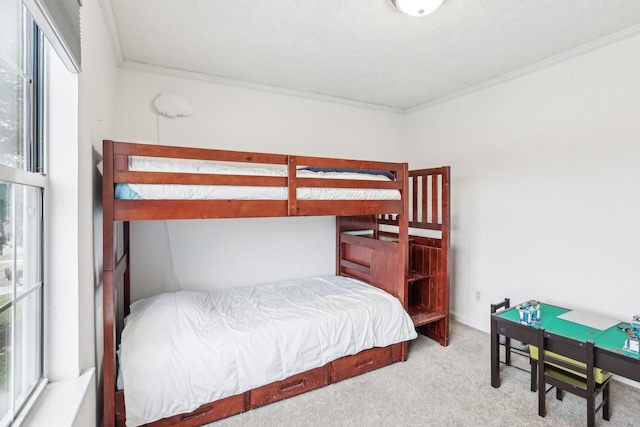 carpeted bedroom with ornamental molding