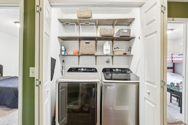 laundry room featuring washer and clothes dryer