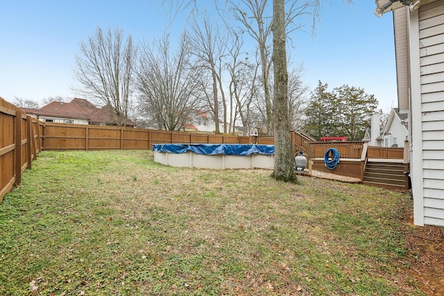 view of yard featuring a covered pool