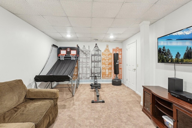 workout area featuring carpet flooring and a drop ceiling