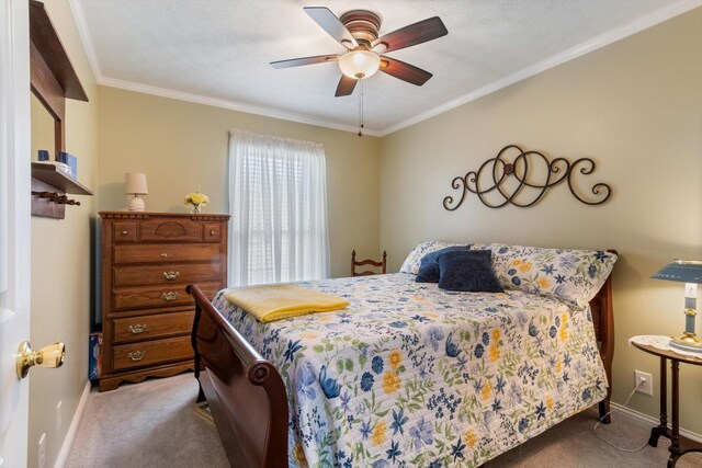 carpeted bedroom featuring crown molding and ceiling fan