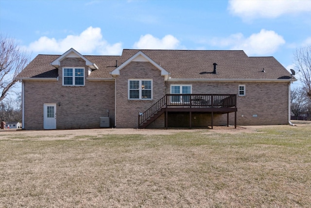 back of property featuring a yard, cooling unit, and a deck