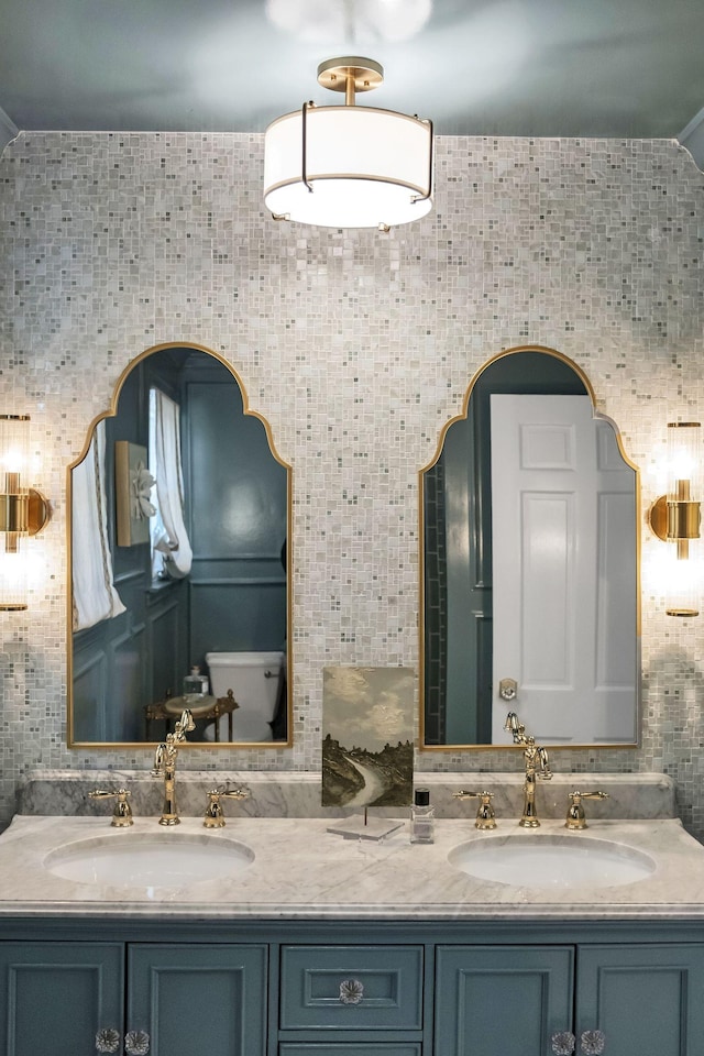 bathroom with vanity and decorative backsplash