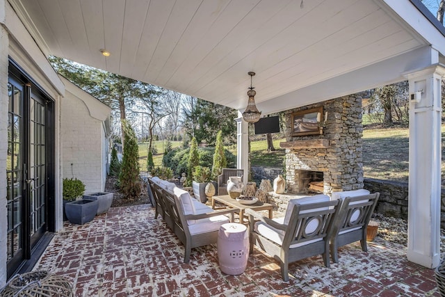 view of patio / terrace featuring an outdoor living space with a fireplace