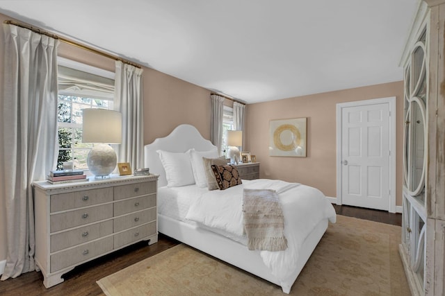 bedroom featuring dark hardwood / wood-style flooring