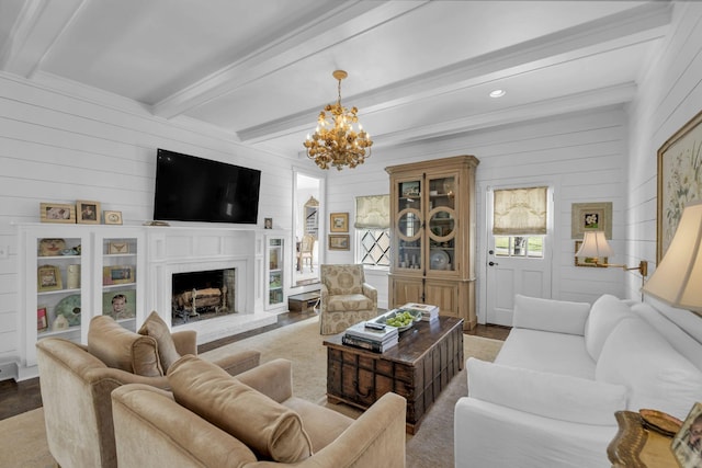 living room with beamed ceiling and a notable chandelier