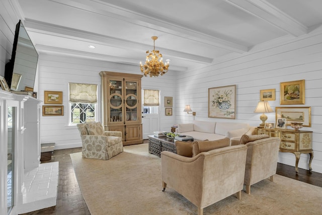 living room featuring a notable chandelier, wood-type flooring, and beamed ceiling