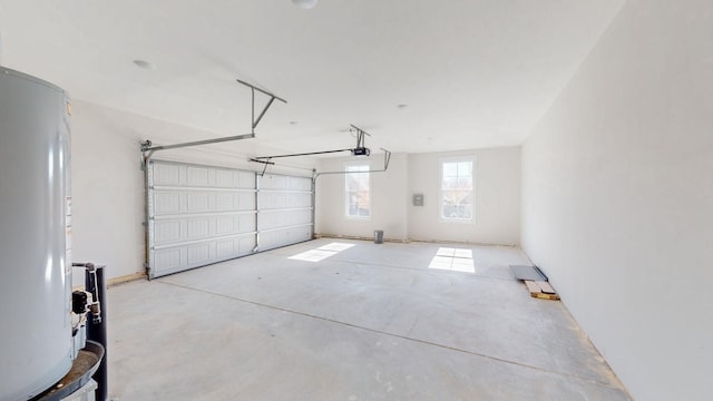 garage with water heater and a garage door opener