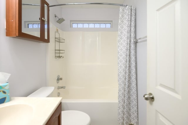 full bathroom with shower / tub combo with curtain, vanity, and toilet