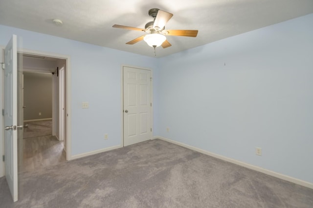 unfurnished bedroom with carpet flooring and ceiling fan