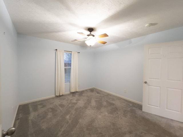 carpeted empty room featuring a textured ceiling and ceiling fan