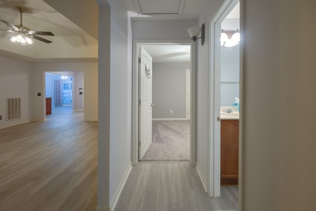 corridor featuring light hardwood / wood-style floors