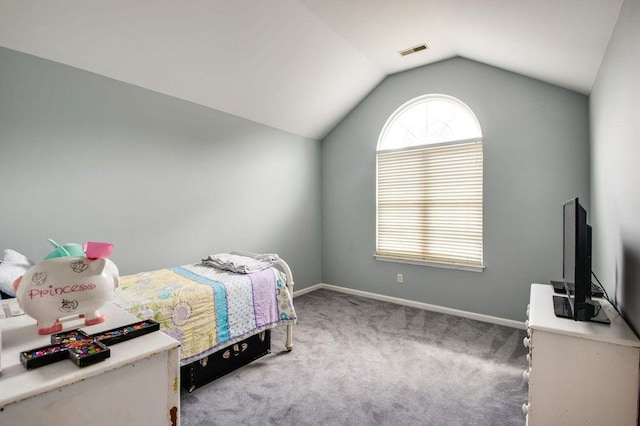 carpeted bedroom featuring vaulted ceiling