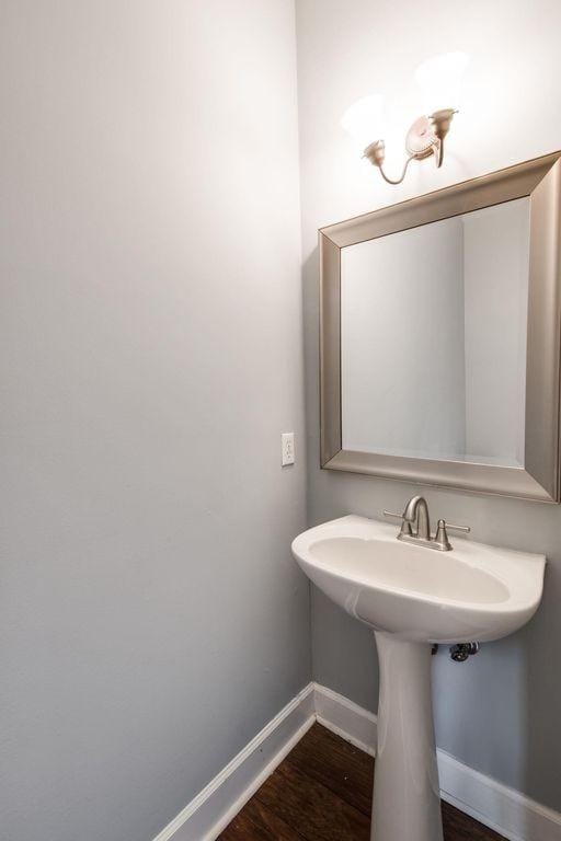 bathroom with hardwood / wood-style floors