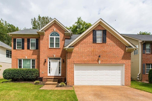 view of front of home with a garage and a front lawn