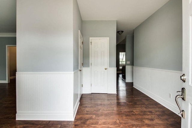 hallway with dark hardwood / wood-style flooring