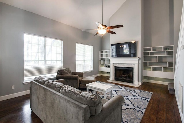 living room with a fireplace, high vaulted ceiling, dark hardwood / wood-style floors, and ceiling fan