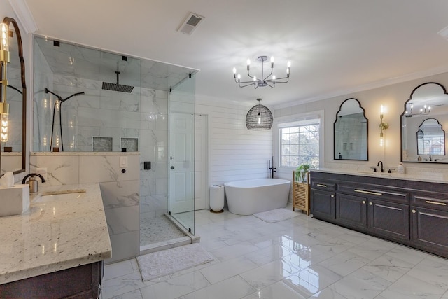 bathroom featuring a notable chandelier, ornamental molding, vanity, and plus walk in shower