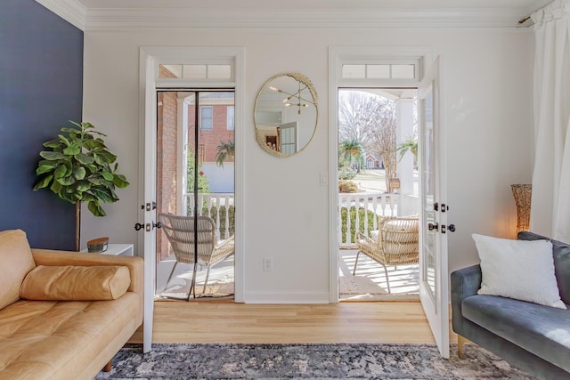 doorway to outside featuring crown molding, plenty of natural light, hardwood / wood-style floors, and french doors