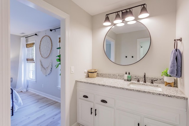 bathroom featuring vanity and hardwood / wood-style floors