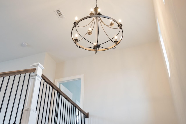 interior details with an inviting chandelier and visible vents