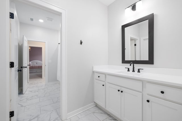 bathroom featuring visible vents, baseboards, ensuite bath, marble finish floor, and vanity