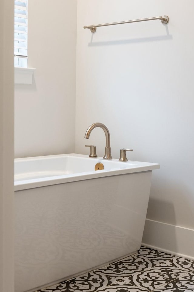 bathroom featuring a soaking tub