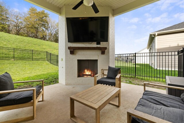 view of patio with an outdoor living space with a fireplace, a fenced backyard, and a ceiling fan