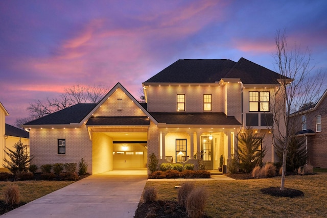 view of front of house featuring concrete driveway, brick siding, covered porch, and roof with shingles