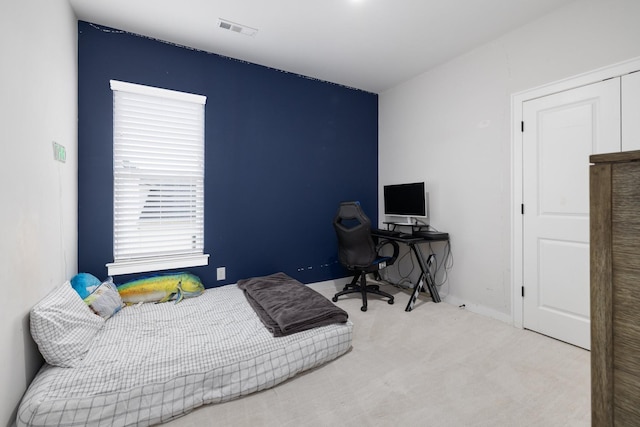 bedroom featuring carpet floors and visible vents