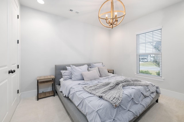 bedroom with light carpet, an inviting chandelier, baseboards, and visible vents