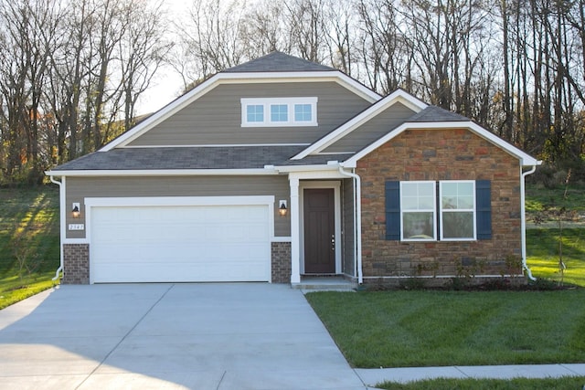 craftsman-style home with a garage and a front yard