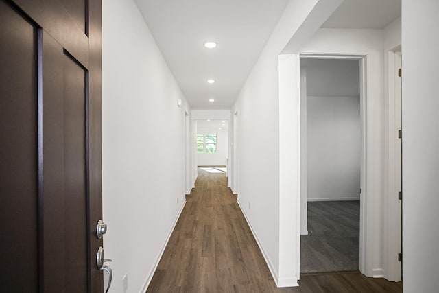 corridor featuring dark hardwood / wood-style floors