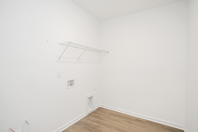 laundry area with hookup for a washing machine, wood-type flooring, and hookup for an electric dryer