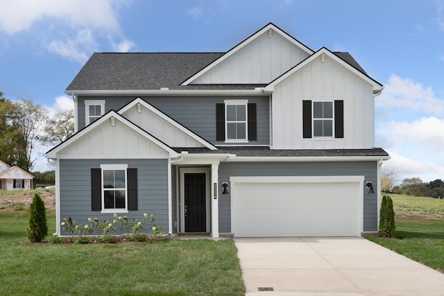 view of front of home featuring a garage and a front yard