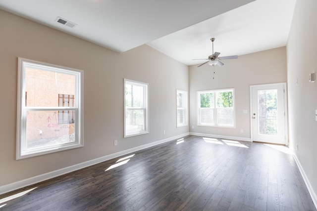 empty room featuring ceiling fan and dark hardwood / wood-style flooring