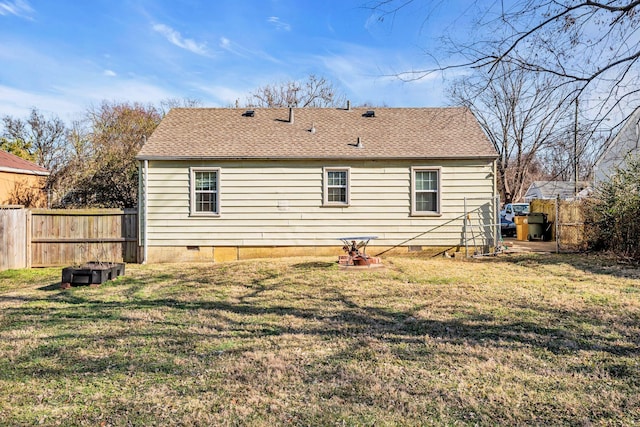 rear view of house with a lawn