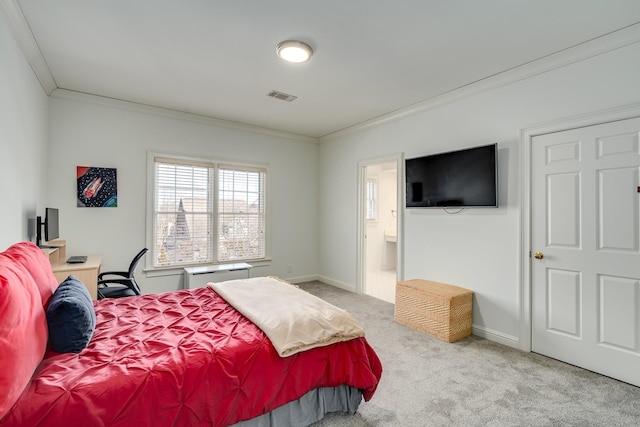 bedroom featuring ornamental molding, light carpet, and ensuite bath