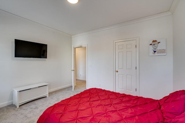 bedroom featuring ornamental molding and light carpet